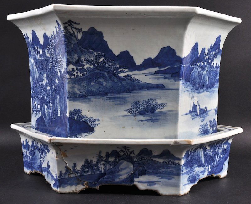 A LARGE 19TH CENTURY CHINESE BLUE AND WHITE PLANTER: A LARGE 19TH CENTURY CHINESE BLUE AND WHITE PLANTER with matching drainer, painted with landscapes, Hairline to base and planter. 1ft 4ins wide.