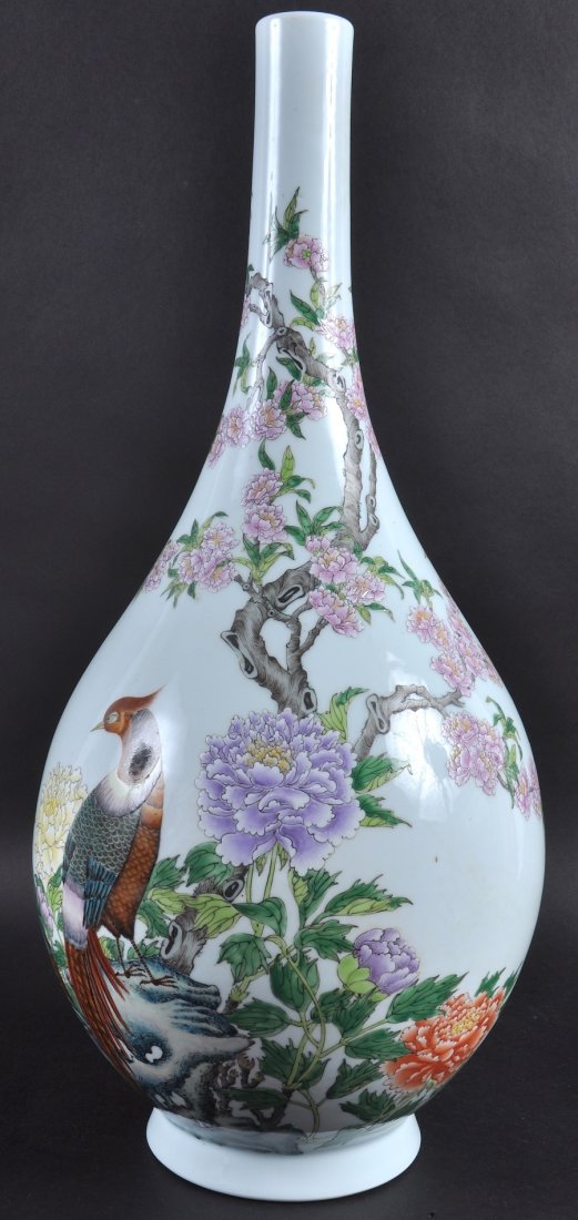AN EARLY 20TH CENTURY CHINESE PORCELAIN ENAMELLED VASE: AN EARLY 20TH CENTURY CHINESE PORCELAIN ENAMELLED VASE Guangxu, bearing Qianlong marks to base, painted with birds upon flowering rock. Good condition. 1ft 6.5ins high.