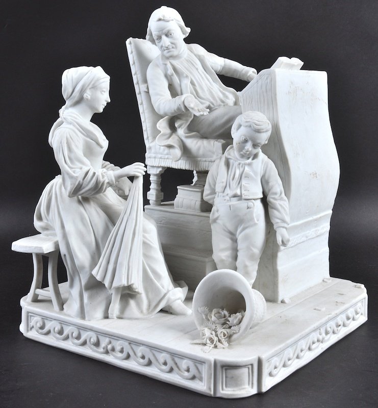 A LARGE SEVRES BISQUE FAMILY GROUP, seated man and woma: A LARGE SEVRES BISQUE FAMILY GROUP, seated man and woman, young boy standing. Incised Sevres Mark. 8.5ins high.