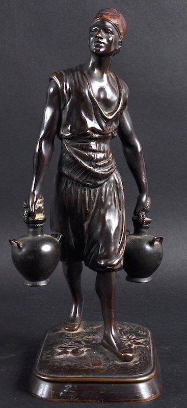 MARCEL DEBUT (1865-?) FRENCH A BRONZE FIGURE OF A YOUNG: MARCEL DEBUT (1865-?) FRENCH A BRONZE FIGURE OF A YOUNG ARAB MAN carrying two pitchers. Signed. 12.5ins high.