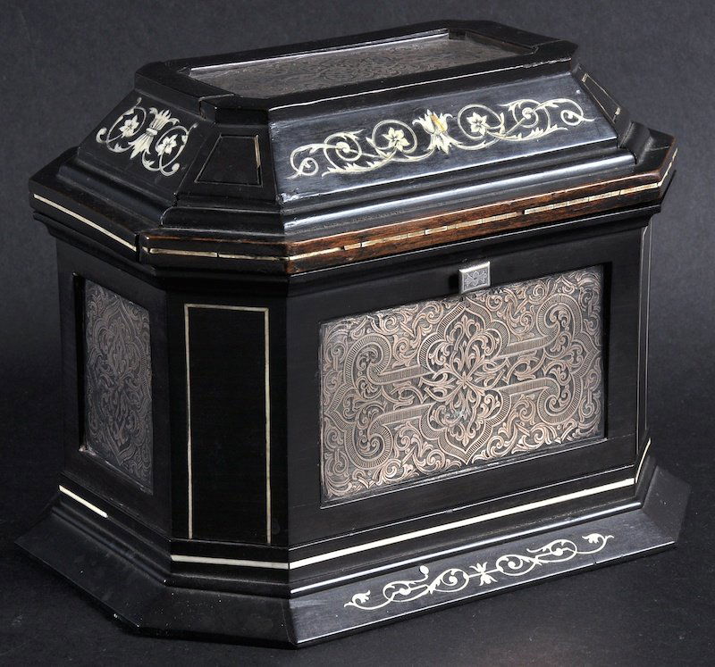 AN ITALIAN EBONY AND IVORY INLAID MOSAIC JEWELLEY BOX w: AN ITALIAN EBONY AND IVORY INLAID MOSAIC JEWELLEY BOX with silver panels and blue velvet interior. 7ins wide.