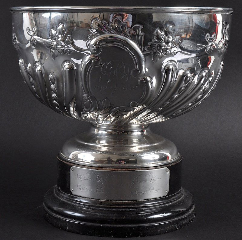 A VICTORIAN WRYTHEN FLUTED CIRCULAR ROSE BOWL, repousse: A VICTORIAN WRYTHEN FLUTED CIRCULAR ROSE BOWL, repousse and flowers. 10ins diameter. London 1898. Weight 27ozs on an ebony plinth.