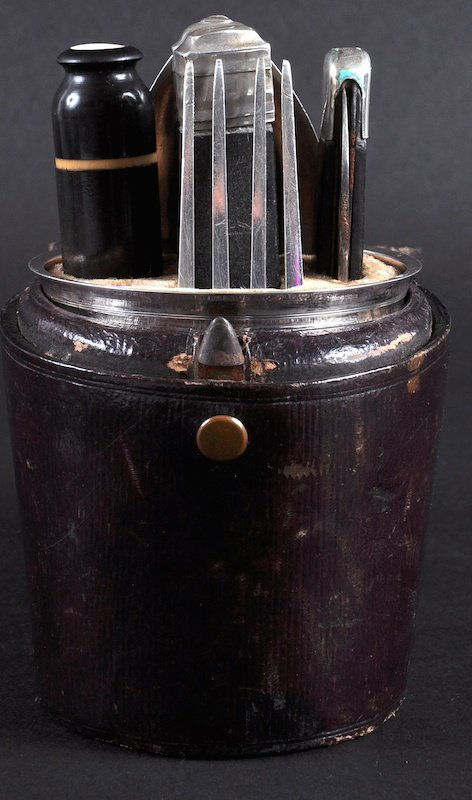 A RARE 18TH CENTURY FRENCH SILVER TRAVELLING KNIFE, FOR: A RARE 18TH CENTURY FRENCH SILVER TRAVELLING KNIFE, FORK, SPOON, SALT, PEPPER AND CUP in a leather case with lift up lid. 5ins high. Provenance: Purchased Mallets, Bond Street.