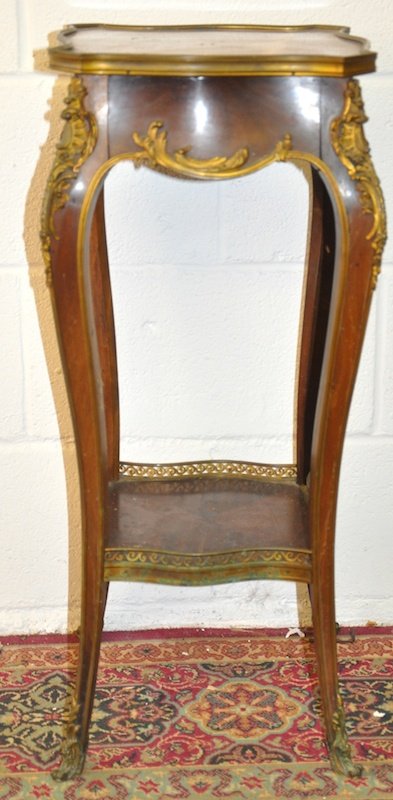 A SMALL 19TH CENTURY FRENCH MAHOGANY TWO TIER STAND wit: A SMALL 19TH CENTURY FRENCH MAHOGANY TWO TIER STAND with ormolu mounts and inset marble top. 2ft 6ins high.
