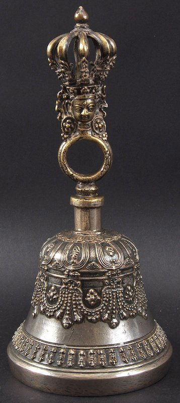 A 19TH CENTURY CHINESE SILVERED METAL BELL together wit: A 19TH CENTURY CHINESE SILVERED METAL BELL together with a hardwood figure of guanyin. 9.5ins & 10.75ins high. (2)