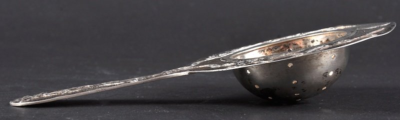 A LATE 19TH CENTURY CHINESE SILVER STRAINING SPOON BY T: A LATE 19TH CENTURY CHINESE SILVER STRAINING SPOON BY TUCK CHANG Shanghai, decorated with perched birds. Minor wear. 6.25ins long.