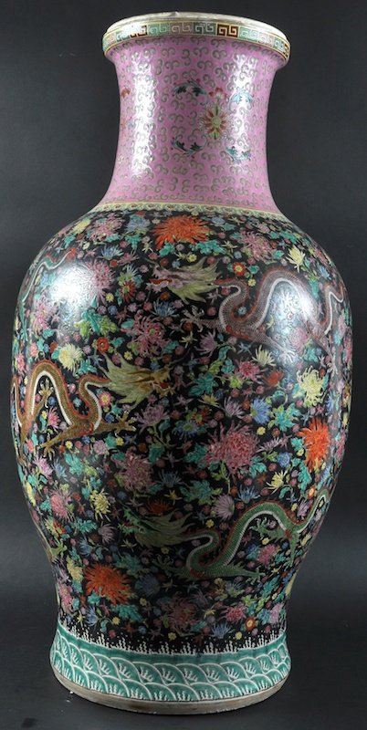 A LARGE EARLY 20TH CENTURY CHINESE STANDING FLOOR VASE: A LARGE EARLY 20TH CENTURY CHINESE STANDING FLOOR VASE painted with a five claw dragon upon a famille noire ground. Minor rim restoration. 2ft 5ins high.
