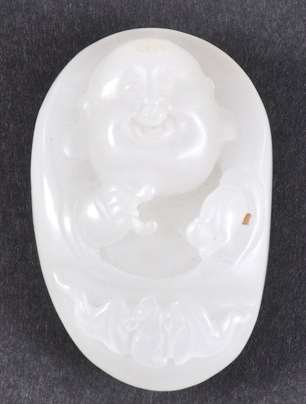 A CHINESE WHITE JADE CARVED FIGURE OF A BUDDHA. Good: A CHINESE WHITE JADE CARVED FIGURE OF A BUDDHA. Good condition. 1.5ins long.