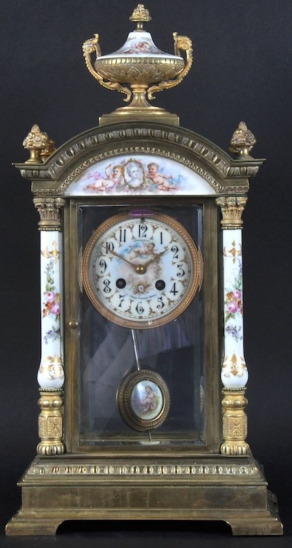 A FINE 19TH CENTURY ITALIAN ORMOLU AND PORCELAIN MANTLE: A FINE 19TH CENTURY ITALIAN ORMOLU AND PORCELAIN MANTLE CLOCK with foliate painted dial, Janetti of Napoli, with similar decorated columns. 1ft 5ins high.