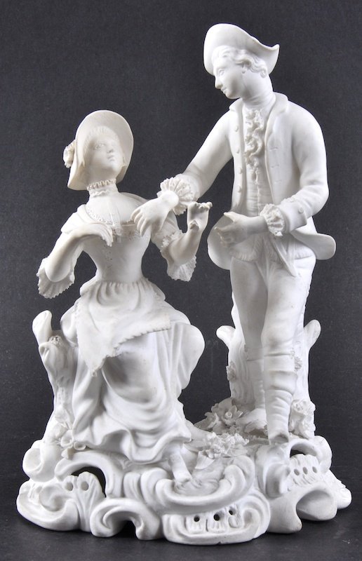 A 19TH CENTURY MINTON BISCUIT FIGURE OF A GALLANT AND: A 19TH CENTURY MINTON BISCUIT FIGURE OF A GALLANT AND COMPANION in period dress.