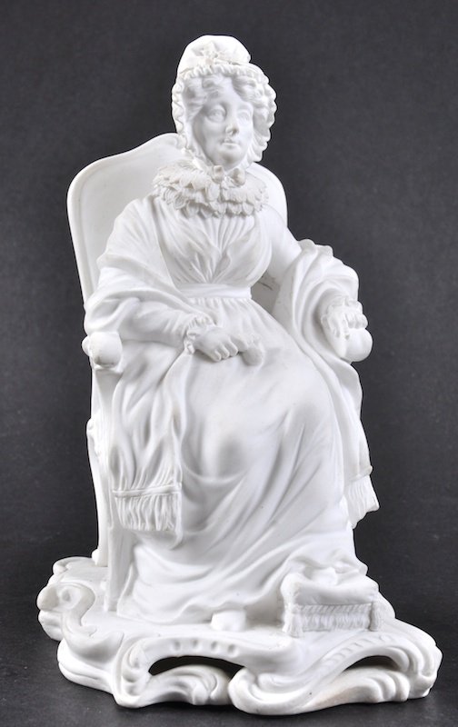 A 19TH CENTURY MINTON BISCUIT FIGURE OF HANNAH MOORE: A 19TH CENTURY MINTON BISCUIT FIGURE OF HANNAH MOORE seated in a chair.