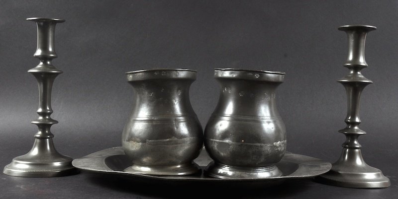 AN 18TH CENTURY PEWTER CIRCULAR PLATE, 15ins diameter,: AN 18TH CENTURY PEWTER CIRCULAR PLATE, 15ins diameter, two QUART TANKARDS and a PAIR OF CIRCULAR CANDLESTICKS (5). Provenance: John Keil, Bath, 1987.