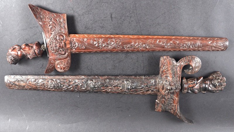 TWO INDIAN KRIS in good quality carved wood sheaths: TWO INDIAN KRIS in good quality carved wood sheaths with handles.
