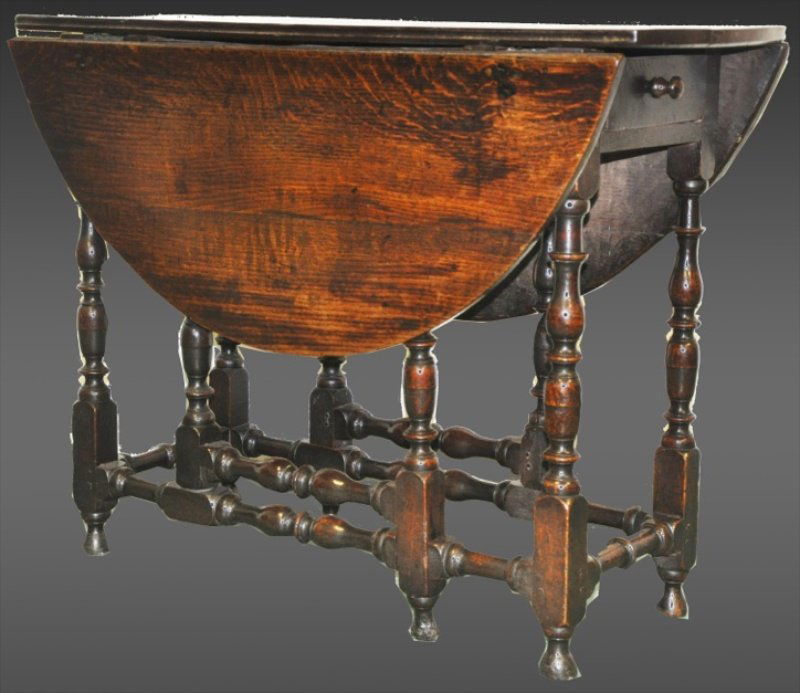 A GOOD WILLIAM & MARY OAK GATE LEG TABLE of small size: A GOOD WILLIAM & MARY OAK GATE LEG TABLE of small size on turned baluster legs and bun feet. Circa 1695. 3ft 6ins wide. Provenance: John Keil, Bath 1987.