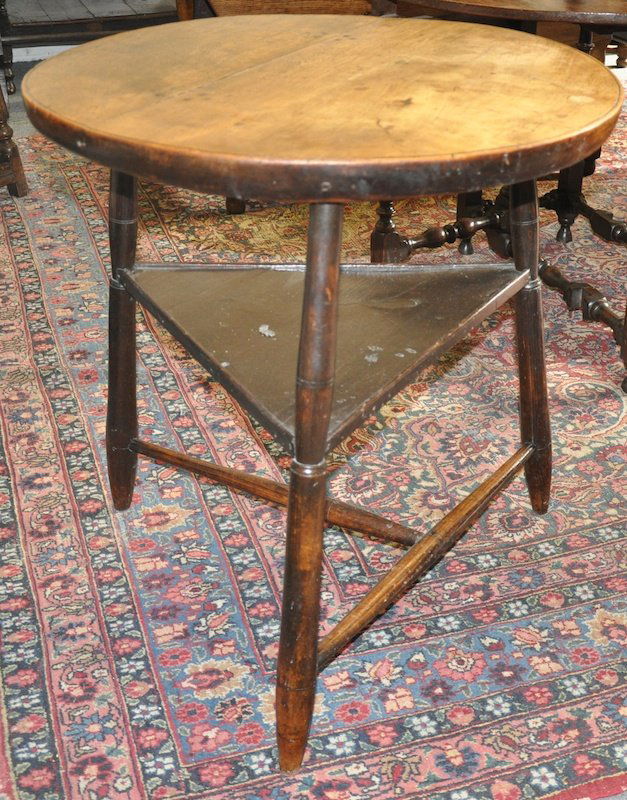 AN 18TH CENTURY YEW WOOD CIRCULAR SLAB TOP CRICKET: AN 18TH CENTURY YEW WOOD CIRCULAR SLAB TOP CRICKET TABLE with fruitwood under tier shelf on turned legs. 2ft 4ins diameter. Provenance: John Keil, Bath 1987.