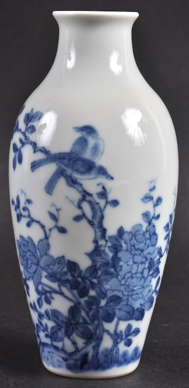 A CHINESE BLUE AND WHITE PORCELAIN VASE probably: A CHINESE BLUE AND WHITE PORCELAIN VASE probably Republican period, painted with birds perched amongst foliage. Good condition. 5.75ins high.