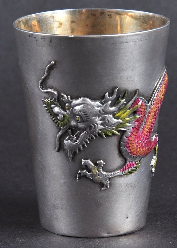 A LOVELY EARLY 20TH CENTURY CHINESE SILVER AND ENAMEL: A LOVELY EARLY 20TH CENTURY CHINESE SILVER AND ENAMEL BEAKER decorated with a four claw dragon. Signed. Good condition. 2.5ins high.
