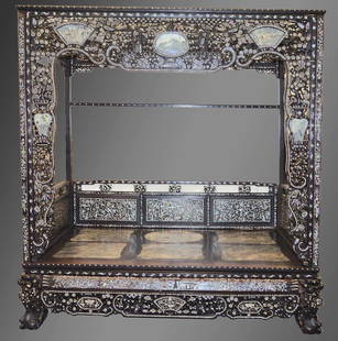 A FINE AND RARE 19TH CENTURY CHINESE HONGMU INLAID BED: A FINE AND RARE 19TH CENTURY CHINESE HONGMU INLAID BED decorated all over with panels of mother and pearl foliage and motifs, with inset marble panels and well carved frieze.