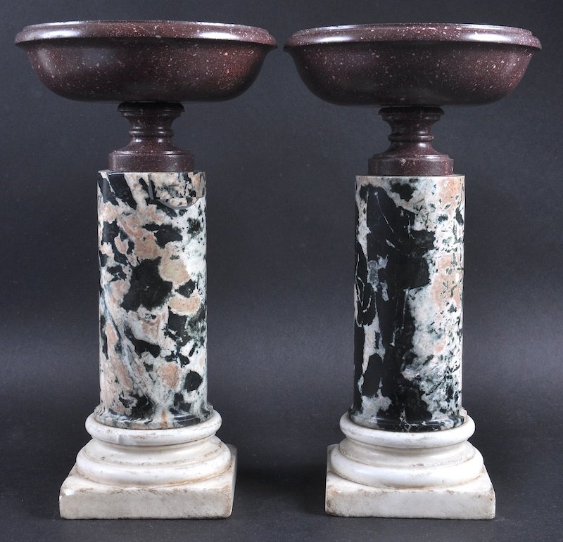A GOOD PAIR OF 19TH CENTURY ITALIAN PORPHYRY CIRCULAR: A GOOD PAIR OF 19TH CENTURY ITALIAN PORPHYRY CIRCULAR TAZZA on marble plinths and stepped bases. £1500-2000.