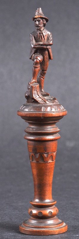 A GERMAN CARVED WOOD FIGURE. 4.25ins high. £25-50.: A GERMAN CARVED WOOD FIGURE. 4.25ins high. £25-50.