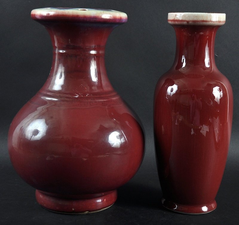 AN EARLY 20TH CENTURY CHINESE SANG DU BOEUF VASE: AN EARLY 20TH CENTURY CHINESE SANG DU BOEUF VASE bearing Yongzheng marks to base, together with another flambé glazed vase. Minor crazing. 12ins high. (2)