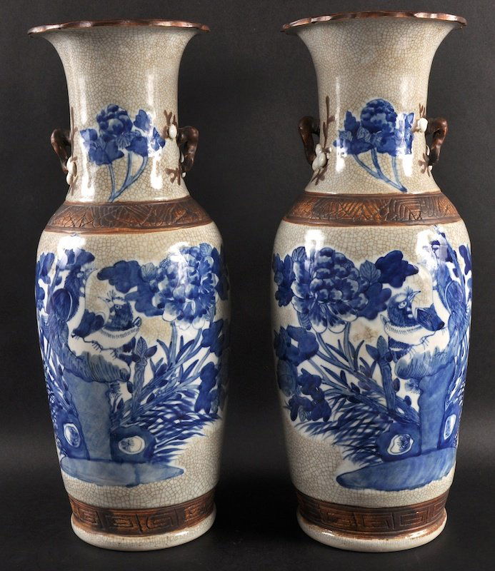 A PAIR OF CHINESE BLUE AND WHITE CRACKLE GLAZED VASES: A PAIR OF CHINESE BLUE AND WHITE CRACKLE GLAZED VASES painted with birds upon hollow rock. Good condition. 19.5ins high.