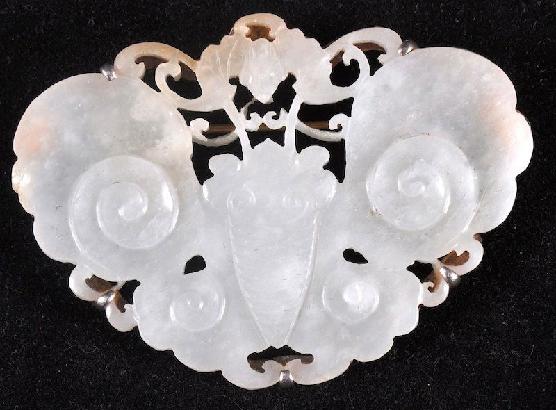A LATE 19TH CENTURY CHINESE WHITE JADE BROOCH in the: A LATE 19TH CENTURY CHINESE WHITE JADE BROOCH in the form of a butterfly, mounted in silver. Small nick to wing. Jade 2.25ins wide.