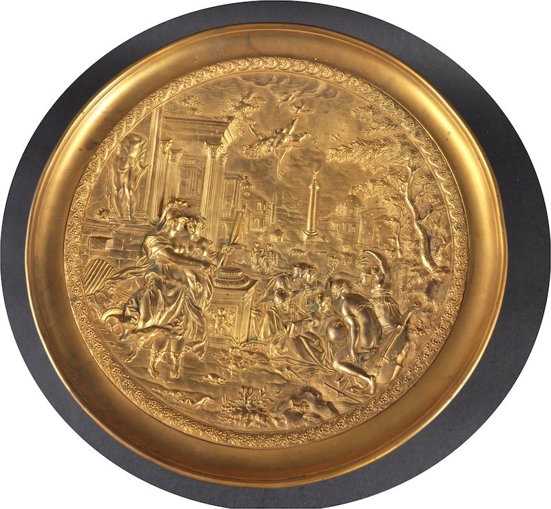 A GILT BRONZE CIRCULAR COMPORT, classical Roman scene: A GILT BRONZE CIRCULAR COMPORT, classical Roman scene on a white circular marble base. 12ins diameter.