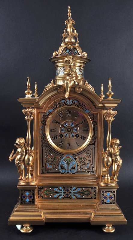 A SUPERB 19TH CENTURY FRENCH BRONZE AND CHAMPLEVE: A SUPERB 19TH CENTURY FRENCH BRONZE AND CHAMPLEVE ENAMEL CLOCK by J. MAYER, PARIS, No. 14699, the case of superb quality with column and cupid supports. 21ins high.