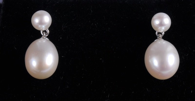 A PAIR OF WHITE GOLD AND PEARL EARRINGS.: A PAIR OF WHITE GOLD AND PEARL EARRINGS.
