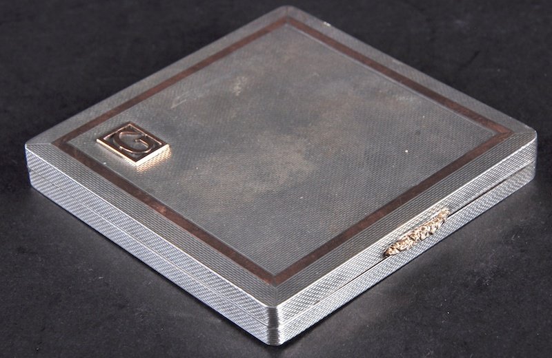 A SILVER AND GOLD COMPACT.: A SILVER AND GOLD COMPACT.
