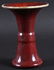 AN 18TH CENTURY CHINESE FLAMBE GLAZED GU FORM VASE of
