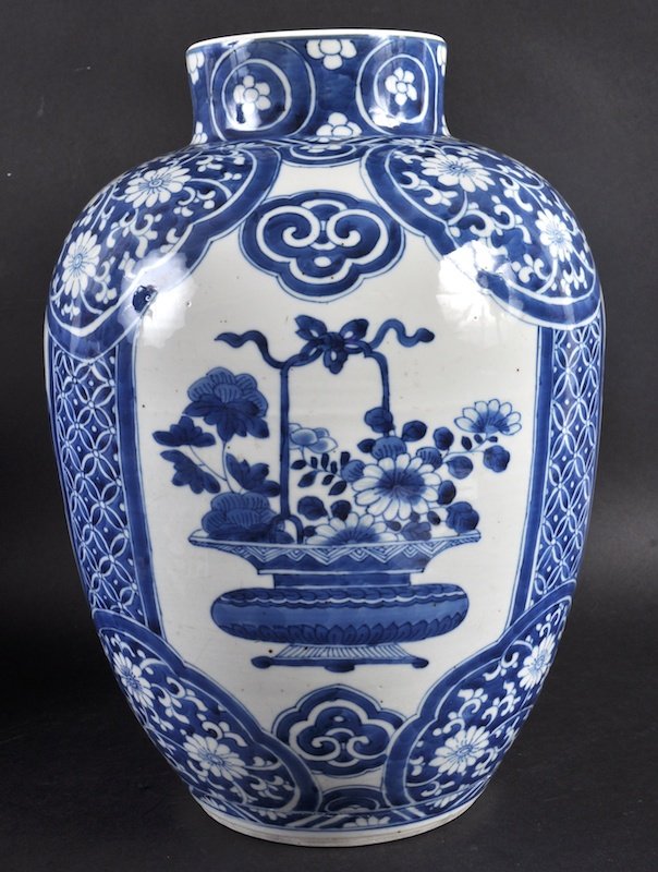 A 17TH CENTURY CHINESE BLUE AND WHITE PORCELAIN VASE: A 17TH CENTURY CHINESE BLUE AND WHITE PORCELAIN VASE Kangxi, well painted with mountainous landscapes and floral banding. Star flaw to base. 13. 5ins high.