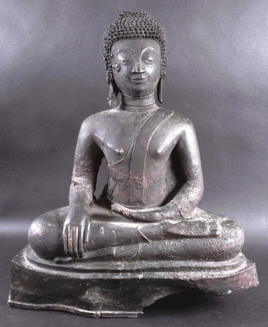 A 17TH CENTURY SOUTH EAST ASIAN BRONZE FIGURE OF: A 17TH CENTURY SOUTH EAST ASIAN BRONZE FIGURE OF AMITAYUS modelled seated upon a triangular base. 2ft high.