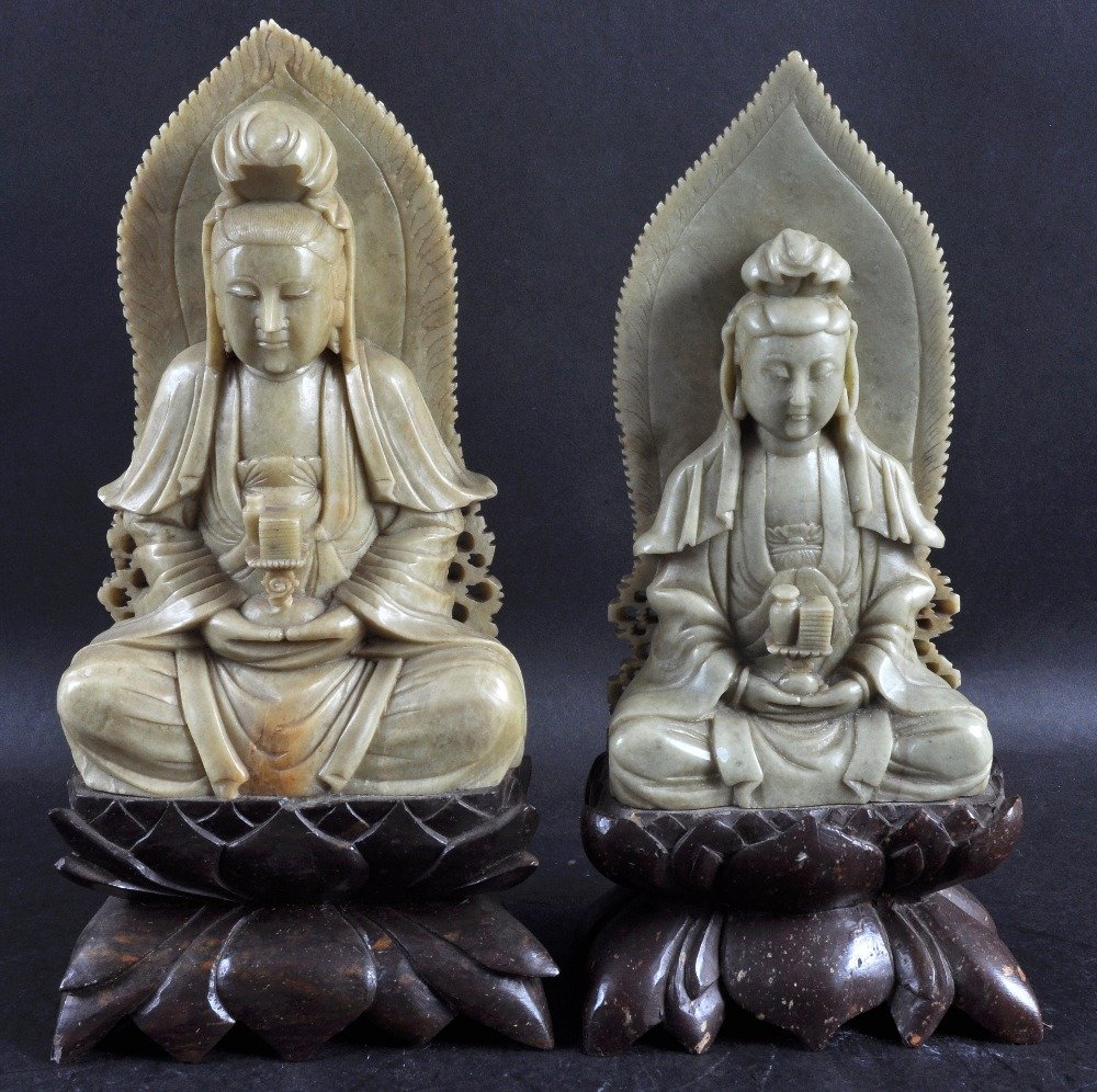 A 19TH CENTURY CHINESE CARVED SOAPSTONE FIGURE OF: A 19TH CENTURY CHINESE CARVED SOAPSTONE FIGURE OF GUANYIN together with another similar figure. 10.75ins & 10.25ins high. (2)