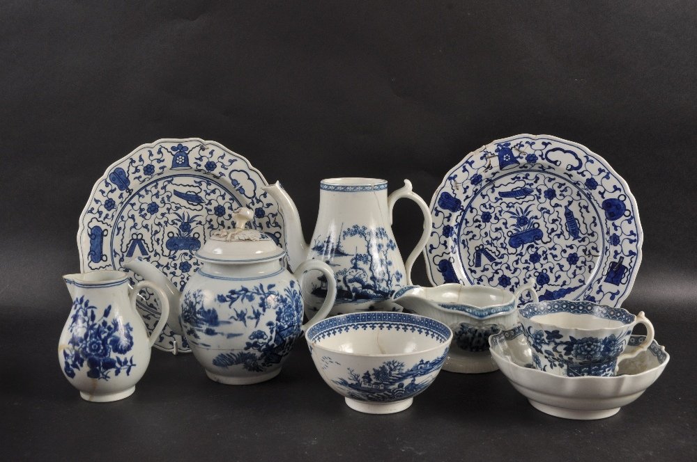 AN 18TH CENTURY WORCESTER TEA POT AND COVER decorated: AN 18TH CENTURY WORCESTER TEA POT AND COVER decorated in blue and white with the Three Flowers pattern, a similar sparrow beak jug, a Cannonball pattern coffee pot, a Worcester sauceboat Strap Fluted 
