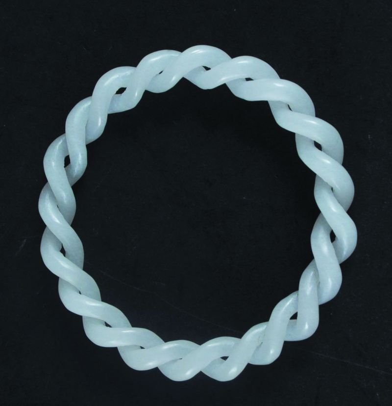 A CHINESE TWO-STRAND WHITE JADEITE BANGLE, 3.25in: A CHINESE TWO-STRAND WHITE JADEITE BANGLE, 3.25in diameter.