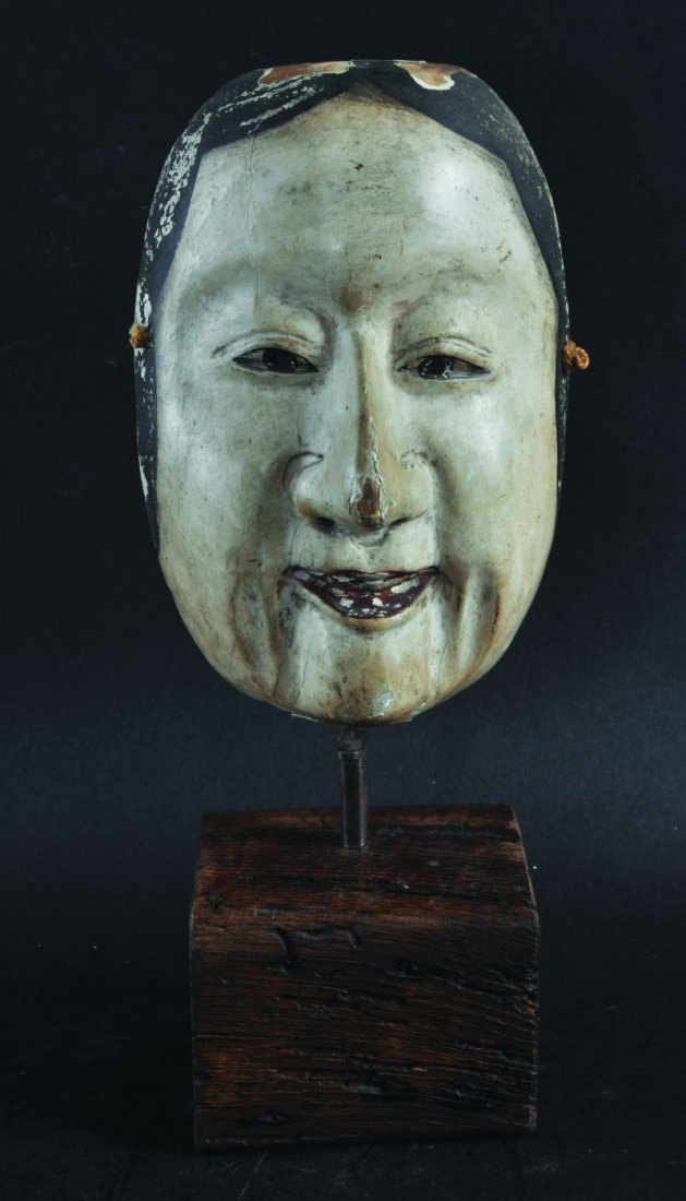 A GOOD 18TH/19TH CENTURY JAPANESE EDO PERIOD NOH MASK: A GOOD 18TH/19TH CENTURY JAPANESE EDO PERIOD NOH MASK OF A WOMAN, decorated in polychrome pigments and gesso on wood, the mask supported on a wood block, 14.1in high overall.