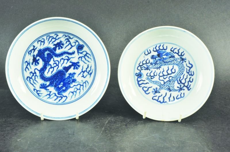 A 19TH CENTURY CHINESE BLUE & WHITE PORCELAIN DRAGON: A 19TH CENTURY CHINESE BLUE & WHITE PORCELAIN DRAGON DISH, the interior and exterior sides painted with dragons amidst flame scrolls, he base with a six-character Guangxu mark, 5.9in diameter; togethe