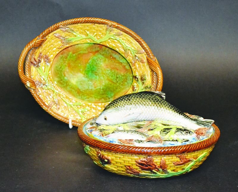 A GEORGE JONES MAJOLICA OVAL SARDINE DISH, COVER AND: A GEORGE JONES MAJOLICA OVAL SARDINE DISH, COVER AND STAND, CIRCA. 1876, Pattern No. 3518, the cover with a fish handle and moulded with various small fish, the basket with seaweed decoration, the bas