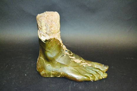 A LARGE ROMAN SCULPTURED FOOT, stone covered in bronze.: A LARGE ROMAN SCULPTURED FOOT, stone covered in bronze. 12ins long, 11ins high.