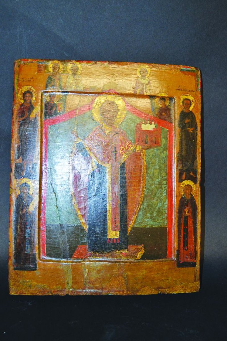 A RUSSIAN ICON painted on wood. 12ins x 10ins.: A RUSSIAN ICON painted on wood. 12ins x 10ins.