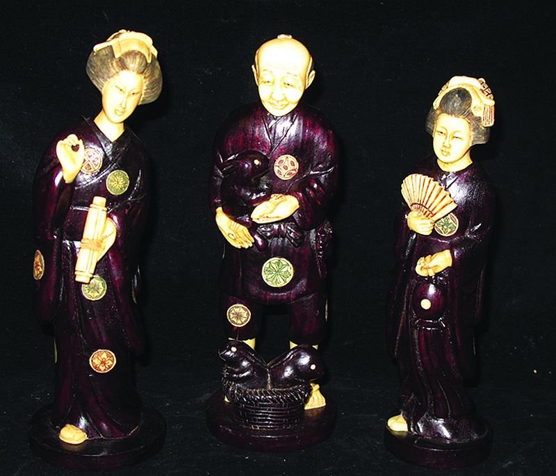 A SET OF THREE JAPANESE CARVED WOOD AND IVORY FIGURES,: A SET OF THREE JAPANESE CARVED WOOD AND IVORY FIGURES, two of ladies in kimonos, the third of a man with rabbits, the highest 8in high. (3) £250-350