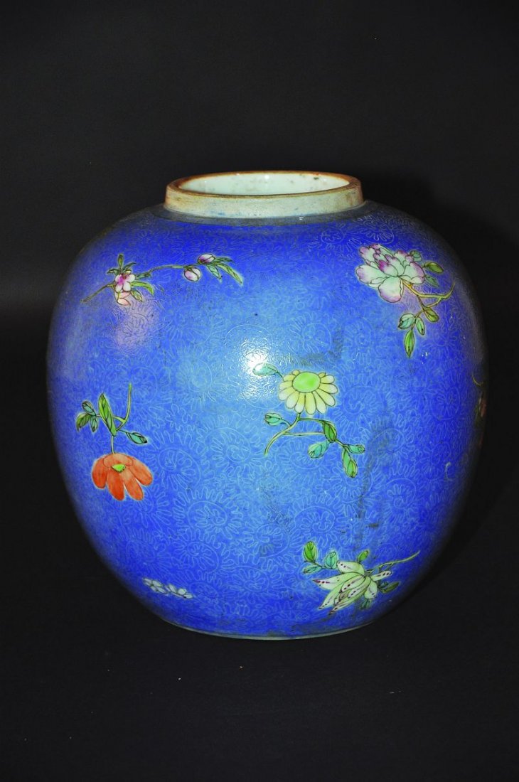 A 19TH CENTURY CHINESE FAMILLE ROSE PORCELAIN JAR,: A 19TH CENTURY CHINESE FAMILLE ROSE PORCELAIN JAR, painted with sprays of loose foliage reserved on a blue sgraffito ground, 8.2in high. £100-150