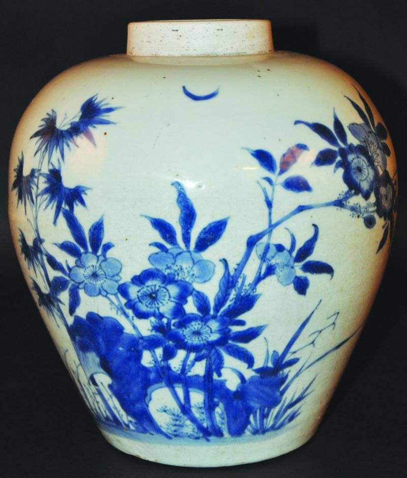 A GOOD 17TH CENTURY CHINESE TRANSITIONAL PERIOD BLUE &: A GOOD 17TH CENTURY CHINESE TRANSITIONAL PERIOD BLUE & WHITE PORCELAIN JAR, the sides of the ovoid body painted with birds in flight near rockwork, bamboo & other foliage, the base unglazed, 10.5in hi