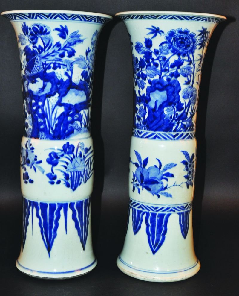 A GOOD LARGE NEAR PAIR OF 17TH CENTURY CHINESE: A GOOD LARGE NEAR PAIR OF 17TH CENTURY CHINESE TRANSITIONAL PERIOD BLUE & WHITE PORCELAIN GU VASES, each similarly painted with a bird and floral scene to each of the flaring necks and a stiff leaf pa