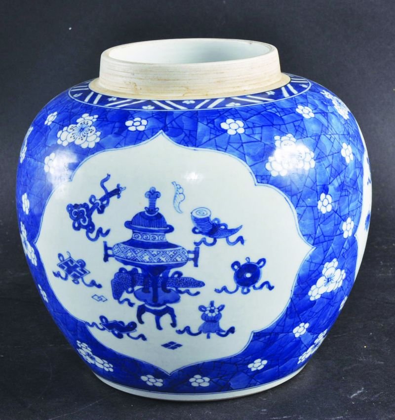 A CHINESE BLUE & WHITE PORCELAIN JAR, painted with: A CHINESE BLUE & WHITE PORCELAIN JAR, painted with panels of precious objects reserved on a crackled ice ground, 7.75in high; together with a pair of 19th Century famille rose shaped quatrefoil dishes
