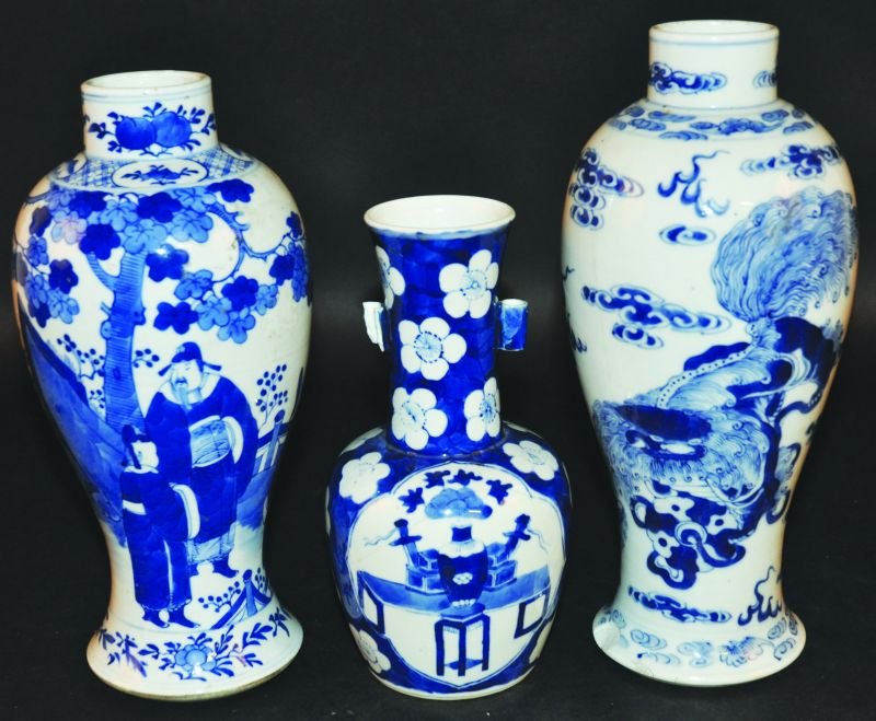 A 19TH CENTURY CHINESE BLUE & WHITE PORCELAIN VASE, the: A 19TH CENTURY CHINESE BLUE & WHITE PORCELAIN VASE, the sides of the baluster form body painted with a mandarin and boy attendants in a garden setting, the base with a four-character Kangxi mark, 10in