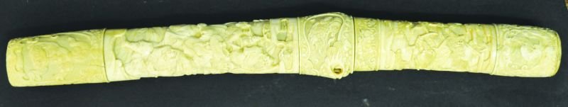 A FINE QUALITY JAPANESE CARVED IVORY TANTO, the sheath: A FINE QUALITY JAPANESE CARVED IVORY TANTO, the sheath and handle carved in detailed relief with samurai and unusually a boar, between foliate ground borders of shi-shi and of birds in flight, 17.6in 