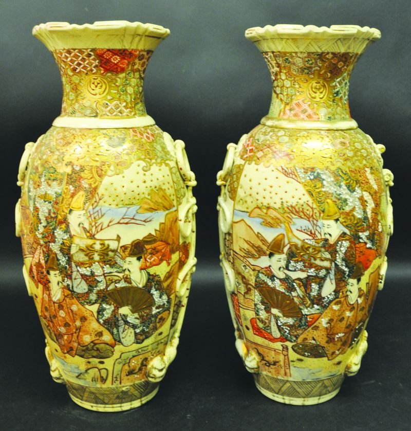 A LARGE PAIR OF EARLY 20TH CENTURY JAPANESE SATSUMA: A LARGE PAIR OF EARLY 20TH CENTURY JAPANESE SATSUMA EARTHENWARE VASES, each decorated with figural panels, 19.9in high. £150-250
